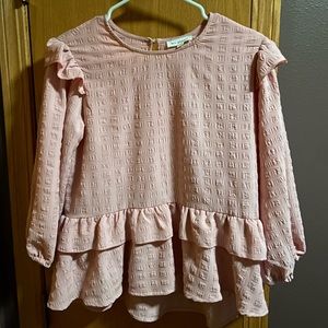 pink ruffled long-sleeve shirt